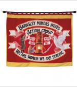 The front page of the greetings card of the banner of the Barnsley Miners Wives Action Group  showing the front of the banner.