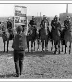 Postcard of a picket holding placard reading "Turn Orgreave into Saltley" on 18th June 1984.